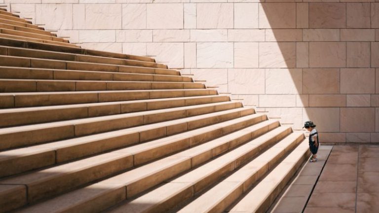 Steps - toddler's standing in front of beige concrete stair