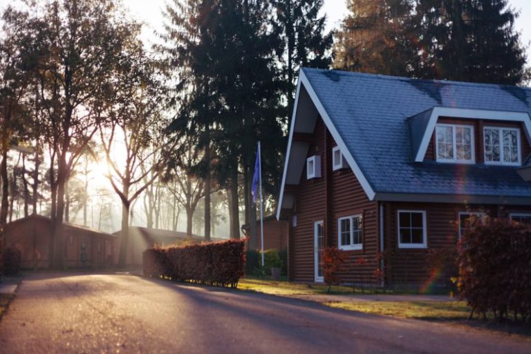 Home - brown and red house near trees