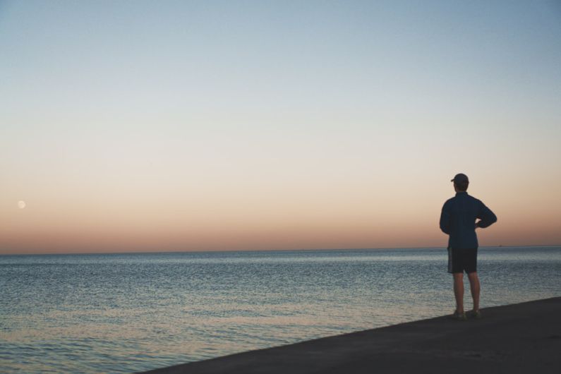 Considerations - man standing near sea