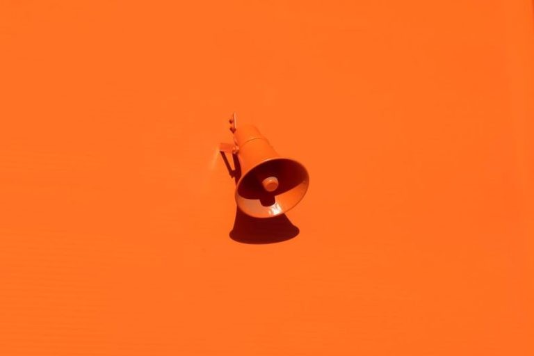Trend - orange megaphone on orange wall