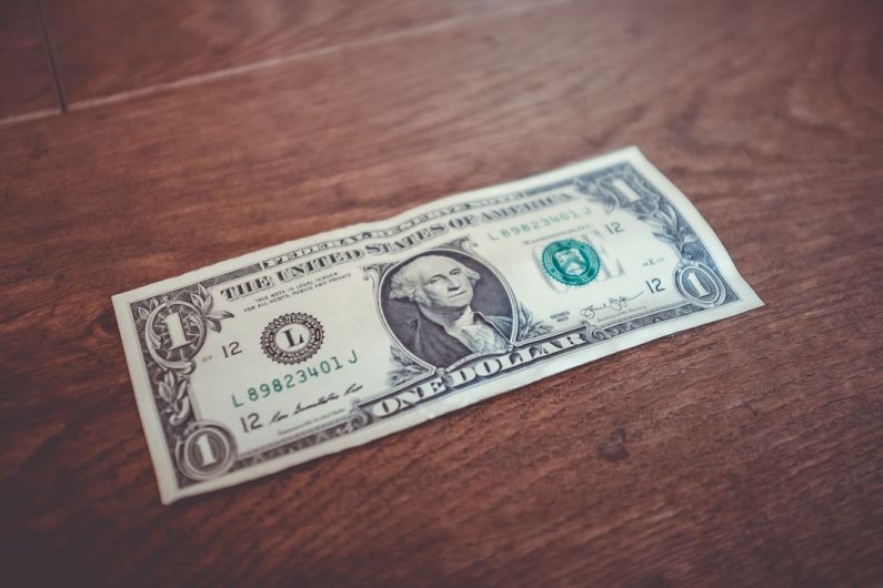 Recession - 1 US dollar banknote close-up photography