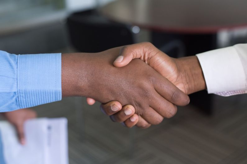 Buyers - two person handshaking