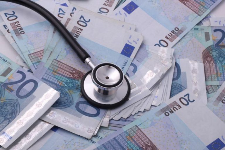 Costs - silver and black stethoscope on 100 indian rupee bill