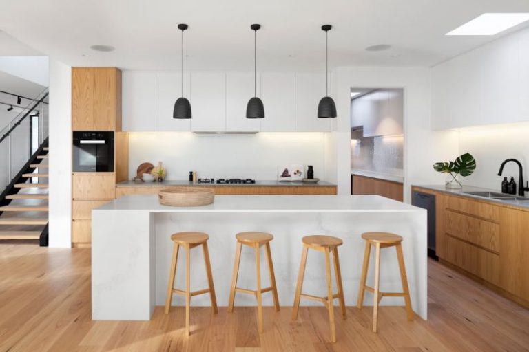 Homes - brown wooden seat beside white wooden table