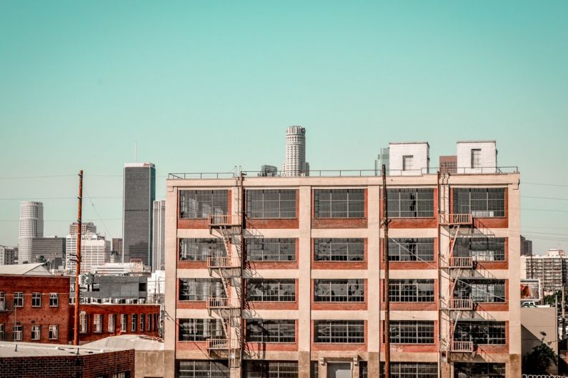 District - white and brown high-rise buildings during daytime