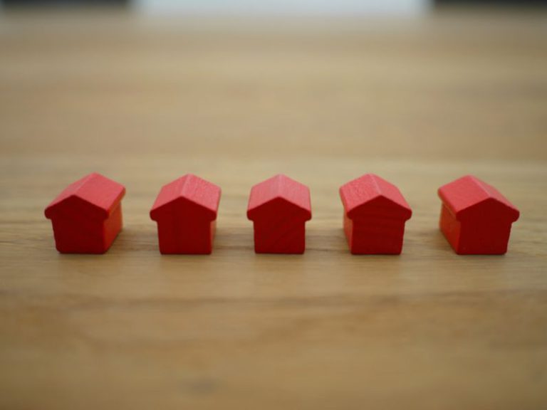 Mortgages - red blocks on brown wooden table