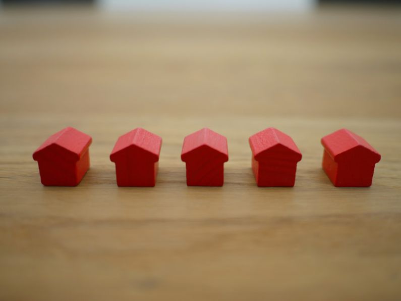 Mortgages - red blocks on brown wooden table