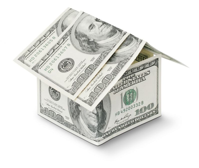 Mortgage - a house made out of money on a white background