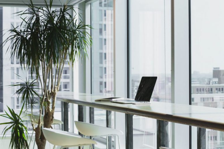 Office - turned off laptop computer on top of brown wooden table